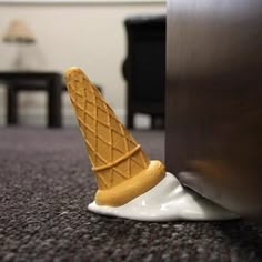 an ice cream cone sitting on the floor