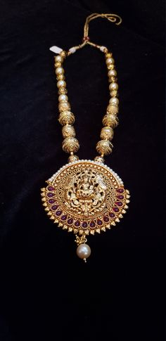 "Handmade Indian Temple Jewelry, best to wear it for traditional ceremonies or Indian wedding. This bridal jewelry has ethnic finish. It has Cubic Zircon stones with ruby and emeralds. It is a Bollywood style one gram jewelry. There are long and short patterns of Indian jewelry in Kundan, Pearls, CZ, American Diamond , ruby, emerald, Polki, kemp to suit every occasion of South Indian and North Indian weddings. Handmade Indian Jewelry item * Stunning Hand made Traditional jewelry set. * Necklace Festive Ruby Temple Necklace With Intricate Design, Ceremonial Temple Jewelry With Ruby, Ceremonial Ruby Temple Jewelry, Ruby Temple Jewelry Jhumkas For Festive Occasions, Ceremonial Temple Jewelry Bridal Necklace With Ruby, Traditional Ruby Temple Necklace For Ceremonial Occasions, Ceremonial Temple Jewelry Ruby Bridal Necklace, Traditional Ruby Temple Necklace, Ruby Kundan Necklace With Intricate Design For Diwali