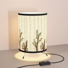 a lamp that is sitting on a table with a cord plugged in to it