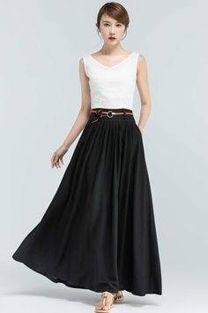 "This Black maxi skirt is the perfect piece for your wardrobe. The Linen skirts is perfect for an afternoon in the city or a walk in the country, the vintage skirt in a wonderful staple, this long skirt will match a variety of ensembles and makes this a must-have. For a twirl-worthy look, pair it with a white blouse or chunky knit sweater and you'll look stylish wherever you're going. Numerous pleats make this a roomy and comfortable skirt. DETAIL * 50% linen ,50% cotton * No Lining * Pleated wa Black A-line Maxi Skirt For Summer, Summer Pleated Waist Maxi Skirt, Summer Maxi Skirt With Pleated Waist, Summer Long Maxi Skirt With Pleated Waist, Black A-line Pleated Skirt For Summer, Black Maxi Skirt For Workwear In Summer, Black Maxi Skirt For Summer Workwear, Summer A-line Voluminous Maxi Skirt, Summer Pleated Waist Flared Maxi Skirt