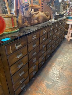 an old wooden dresser with many drawers