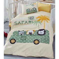 a child's bed with an animal themed comforter