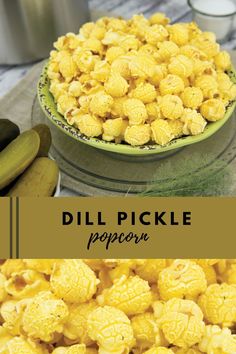 a bowl filled with yellow popcorn next to cucumbers and pickles on a table