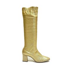 Vintage 1960s gold lamé stretch fabric knee high gogo boots. Features gold lamé stretch fabric uppers, rounded toe, knee high rise, elastic at top of shaft, and sleep block heel. Excellent vintage condition.   Heel to toe (inside shoe): 9.125 inches  Ball of foot (bottom of sole): 2.75 inches  Heel height: 2.375 inches  Shaft height: 15.75 inches  Circumference: 11.5 inches + stretch  Size 5 Glamorous Metallic Knee-high Boots, Gold Knee-high Boots For Fall, Fitted Mid-calf Heeled Boots For Party, Gold Round Toe Knee-high Boots For Fall, Fitted Knee-high Gold Boots, Gold Fitted Knee-high Boots, Fitted Gold Knee-high Boots, Stretch Knee-high Boots For Winter Party, Gold Heeled Boots With Round Toe For Winter