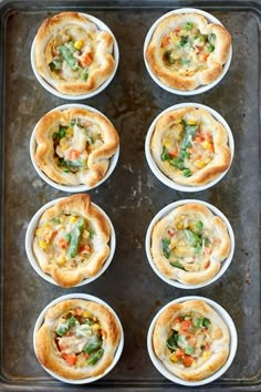 several small cups filled with food on top of a pan