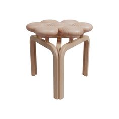 three wooden stools sitting on top of each other