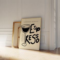 there is a sign that says esp kesso next to a wine glass on the floor