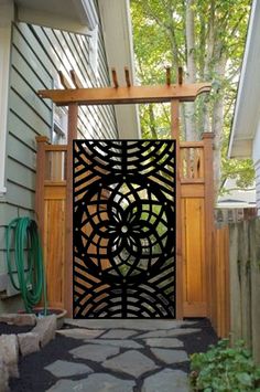 an open gate in front of a house