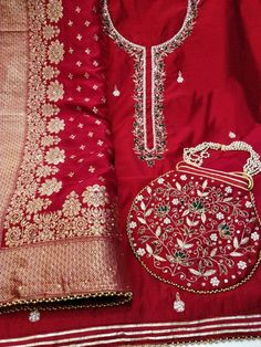 Item Overview ATHARVA Hand Embroidery Salwar Kameez/Embroidery Neck Reds/Banarsi Silk Dupatta/ Embroidered Potli/Stitch Unstitch/Tunic/Patiala/Churridar/Anarkali Dno. CH1693 Fabric: * Shirt - Chanderi Silk- Hand Embroidered Neck - Red- 2.5 Mts - Beautiful Hand Embroidery * Dupatta: Banarasi Dola Silk Dupatta- All over Embroidery - 2.5 Mts- Latkans Tassels - Reds BEAUTIFUL EMBROIDERED POTLI * Bottom Santoon Silk 2.5 Mts. Excusive Hand Embroidered Party Wear Punjabi Suit. Customization: * Fabrics Patiala Salwar Kameez, Embroidery Dupatta, Patiala Salwar, Embroidered Pants, Punjabi Suit, Indian Aesthetic, Silk Dupatta, Punjabi Suits, Different Fabrics