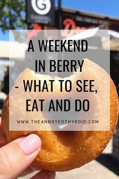 a hand holding a donut with the words, a weekend in berry what to see, eat and do