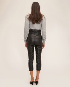 An update to our high-waist leather pant, the Anniston features a removable D-ring grommet belt and slightly tailored fit. High-waist fit Asymmetrical waist detail Slim fit Functional front slant pockets Front fly zipper closure Back welt pockets Removable D-ring belt with grommet detail 100% Polyester Lining 100% Lamb Leather Model is 5’10” and wearing a size 2. This style runs true to size with an intentionally cropped, tailored fit. We would recommend taking your regular size. Grommet Belt, D Ring Belt, Marissa Webb, Ring Belt, Leather Pant, D Ring, Welt Pockets, Welt Pocket, Capri Pants