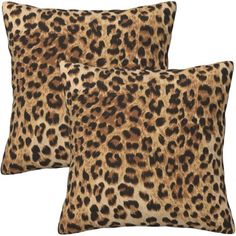 two leopard print pillows sitting on top of each other