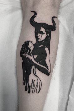 a woman with horns on her head holding a man's arm in black ink