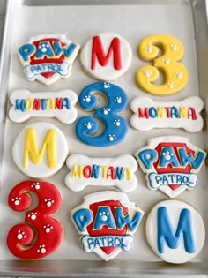 decorated cookies in the shape of letters and numbers