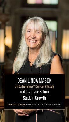 an older woman with long white hair smiles in front of a black sign that reads dean linda mason on ballmer's con - boy attitude and graduate school student growth