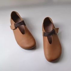 Brown Leather Shoes With Textured Sole And Flat Heel, Brown Closed Toe Leather Shoes With Textured Sole, Brown Leather Shoes With Leather Footbed And Flat Heel, Brown Flats With Stitched Sole, Beige Leather Flats, Brown Leather Slip-on Flat Shoes, Brown Leather Shoes With Flat Heel, Brown Leather Shoes With Medium Width Flat Heel, Brown Almond Toe Flats With Removable Insole