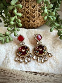 These exquisite earrings are handcrafted with intricate inlay work, featuring vibrant semi-precious stones set in a rich, red background. The intricate design is adorned with glistening crystals and accented with delicate crystal drops, creating a stunning and eye-catching pair of earrings. Crafted with meticulous attention to detail, these earrings are a true work of art. The inlay technique showcases the skill and artistry of the craftsperson, resulting in a unique and timeless piece of jewelry. Whether for a special occasion or as an everyday accessory, these earrings are sure to elevate any outfit and add a touch of elegance. Perfect for those who appreciate exquisite craftsmanship and one-of-a-kind designs. ------------------------------------------------------------------------------ Everyday Accessories, Semi Precious Stones, Crystal Drop, Keep Jewelry, Jewelry Inspo, Intricate Design, Red Background, Stone Settings, Timeless Pieces