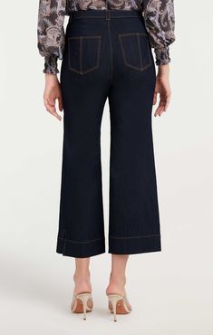 Indulge in the timeless classic, the Benji Pant. These wide-leg cropped denim jeans feature utilitarian patch pockets for a look that yours must-have. Essential for any wardrobe! Details Button flyFabric: Indigo DenimHigh risePatch pocket detail Cropped Content and Care 77% Cotton 21% Polyester 2% ElastaneDry Clean OnlyImported Measurements 26in/66.04cm, inseamMeasurements from size 4 Spring Workwear Flare Jeans With Contrast Stitching, Workwear Pants With Contrast Stitching And Cropped Leg, Workwear Cropped Leg Pants With Contrast Stitching, Denim Blue Flare Jeans With Patch Pockets For Work, Spring Cropped Jeans In Denim Blue With Patch Pockets, Spring Cropped Jeans With Patch Pockets In Denim Blue, Denim Blue Cropped Leg Pants With Welt Pockets, Cropped Leg Bottoms With Contrast Stitching For Fall, Fall Bottoms With Contrast Stitching And Cropped Leg