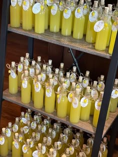 many bottles of yellow liquid are on shelves