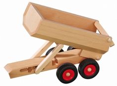 a wooden toy truck with red wheels