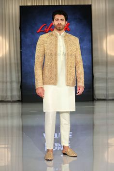 Check out the fully embroidered and hand embellished open front golden prince coat, paired with kurta pajama and shoes. Our stunning ensemble on display at the London Lifestyle Show on 17-18 June 2023. Luxury Single Breasted Nehru Jacket For Winter, Gold Embroidered Bandhgala Straight Kurta, Gold Embroidered Straight Kurta Bandhgala, Designer Bandhgala With Gold Embroidery Straight Kurta, Designer Gold Sets With Naqshi Detailing, Gold Nehru Jacket With Gold Embroidery For Diwali, Festive Nehru Jacket With Gold Embroidery And Long Sleeves, Festive Nehru Jacket With Gold Embroidery, Gold Nehru Jacket With Gold Embroidery For Designer Wear