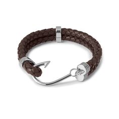 A classic feature for a considered ensemble, OTAA's Fish Hook Brown Bracelet is ebullient with a nautical feel. The exclusivity of a suit is determined in the attention to its fine details, and the impeccable leather features of this Fish Hook Brown Bracelet will ensure that your attire exudes excellence from the seams. Made from leather and accented with a hand-chiselled silver rhodium fish hook, this bracelet is unparalleled in design and quality. The folded double band is clasped together by Leather Bracelets For Men, Brown Bracelet, Anchor Bracelet, Braided Leather Bracelet, Leather Bracelets, Braided Leather, Fish Hook, Leather Band, Bracelets For Men