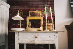 an old table with various items on it