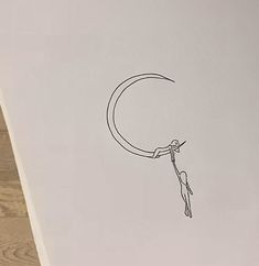 a drawing of a person dangling from a crescent