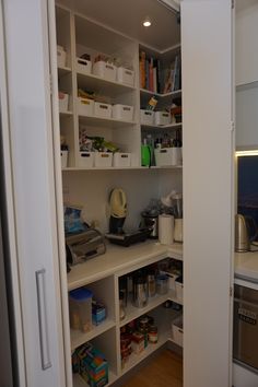 an open pantry with lots of food in it