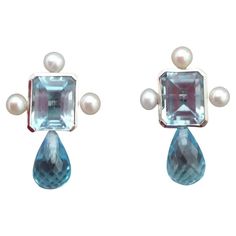 Sky Blue Octagon Topaz White Gold Faceted Blue Topaz Drops Pearls Stud Earrings | From a unique collection of vintage Stud Earrings at https://www.1stdibs.com/jewelry/earrings/stud-earrings/. Classic Round Blue Topaz Earrings, Luxury Light Blue Blue Topaz Earrings, Light Blue Blue Topaz Gemstone Earrings, Luxury Blue Topaz Earrings, Luxury Blue Topaz Drop Earrings, Vintage Stud Earrings, Blue Topaz Jewelry, Estilo Art Deco, Pearl Stud Earrings