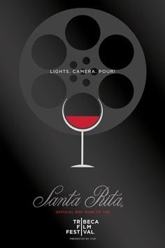 a wine glass with red wine in it and the words lights camera pour written below