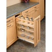 an open drawer in the middle of a kitchen