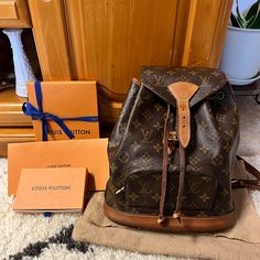 This Is The Authentic Louis Vuitton Monogram Montsouris Mm Backpack. This Refined Backpack Is Crafted Of Monogram Coated Canvas. The Backpack Features Vachetta Leather Trim, Base, Shoulder Straps, And Cinch-Cord. The Bag Also Includes Brass Hardware, An Exterior Zipper Pocket, And A Flap With A Vachetta Leather Belt Closure. Good Condition. Deep Patina And Watermarks Throughout Vachetta Leather (Bottom Part-Base), Super Light Scuffing Trim On The Opening, And Tarnishing On The Hardware. Length: 10" (25 Cm) Height: 11" (27 Cm) Depth: 5" (12 Cm) Date Code: Sp0959 Luxury Pre-owned Brown Bag, Pre-owned Designer Brown Bags, Vintage Travel Bag In Signature Coated Canvas, Vintage Bags In Signature Coated Canvas For Daily Use, Vintage Signature Coated Canvas Bags For Daily Use, Vintage Brown Signature Coated Canvas Bag, Pre-owned Monogram Canvas Bag For Daily Use, Pre-owned Monogram Canvas Bags For Everyday Use, Designer Pre-owned Travel Bags