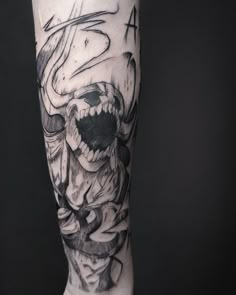 a man's leg with a tattoo on it that has a skull in the middle