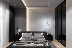 a bed sitting in the middle of a bedroom next to a wall mounted light fixture