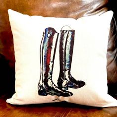 a pillow with a pair of boots on it