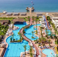 an aerial view of a resort pool and water slide