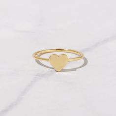 Beautiful, and dainty heart ring. - - - D E T A I L S - - - * Made of 925 Sterling Silver * Available in 14k Gold or Rhodium Plated * We use a THICK plating of 14k Gold for a piece that is sure to last years to come * Nickel-free & Hypoallergenic * WILL NOT TURN FINGER GREEN! * Available in Sizes 4, 5, 6, 7, 8, 9, or 10 * Ring Measurements: Heart: 7mm WIDTH: 1.3mm Ring Sizer- https://www.etsy.com/listing/1240904225/ring-sizer-reusable-ring-sizer-plastic?click_key=b5e074cfb419bcfddc2d9f2ce4b2f537 Simple Heart-shaped Stackable Promise Rings, Dainty Stackable Heart Cut Rings With Heart Charm, Dainty Heart Cut Stackable Rings With Heart Charm, Delicate Heart-shaped Stackable Promise Rings, Minimalist Heart Shaped Stackable Promise Rings, Simple Heart-shaped Midi Promise Ring, Heart Shaped Stackable Rings For Everyday, Dainty Heart-shaped Stackable Rings For Anniversary, Delicate Stackable Heart Promise Ring