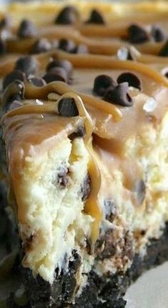 a piece of cake with chocolate chips and caramel drizzles on top