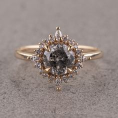 an engagement ring with a brown diamond surrounded by white diamonds