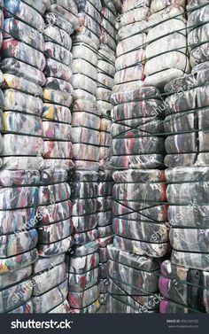 stacks of newspapers and magazines stacked on top of each other in plastic bags stock photo