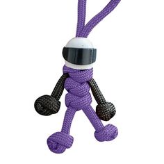 a purple toy with a white helmet on it's head