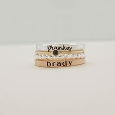 Show off your name and birthstone in style with this stunning Stacking Name Ring Set! Includes 4 stackable rings: a sterling silver beaded ring, a fine silver name ring, a 14K gold-filled birthstone ring, and a 14K gold-filled name ring Perfect personalized gift for mom, wife, daughter, sister or friend Name ring beautifully displays any name or date in elegant lowercase script and modern typewriter font Choose your personalized birthstone to represent your birthday month This one-of-a-kind ring Adjustable Stackable Sterling Silver Birthstone Ring, Adjustable Stackable Birthstone Ring For Promise, Stacked 14k Gold Jewelry For Anniversary, Adjustable Stackable Birthstone Promise Ring, Adjustable Stacked Sterling Silver Jewelry, Adjustable Stackable Birthstone Ring For Anniversary, Fine Jewelry Sterling Silver Stackable Engraved Ring, Sterling Silver Stackable Engraved Ring, Fine Jewelry Engraved Sterling Silver Stackable Ring