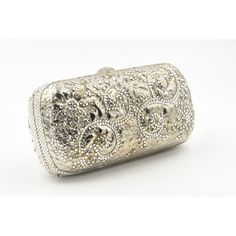 Elegant Judith Leiber silver metal and crystal oblong evening bag clutch featuring a scrolling foliage flower design on a silver - toned metal bag.  The hardware is silver.  It has a silver leather interior with a silver shoulder strap that can be folded inside when you want to wear it as a clutch.  There is a circle that folds out to hold a tassel, but it is no longer there.  Labeled ‘Judith Leiber/New York’ in the interior. 5.5” W x 3” H x 1.5” D  A similar one sold at Chrisities from Joan Riv Silver Evening Bag Rectangular Case, Silver Evening Bag With Rectangular Case Shape, Luxury Metallic Silver Bag For Formal Occasions, Luxury Silver Clutch, Elegant Engraved Gold Bags, Luxury Formal Clutch With Silver-tone Hardware, Silver Clutch With Silver-tone Hardware For Events, Rectangular Wedding Bags With Silver-tone Hardware, Evening Clutch With Silver-tone Hardware