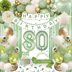 an 80th birthday card with balloons, flowers and greenery on the table in front of it