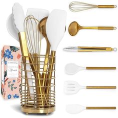 gold and white kitchen utensils in a vase