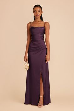 a woman in a long purple dress