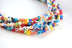 "*The listing provides 4mm flat flower shape multicolour murano style beads on a strand. *Beads are made of glass. *Bead size is 4mm (0.157\" inch). *Thickness is 2.5mm (0.098\" inch). *The hole size is 0.8mm (0.031\" inch). *Each strand comes as 40cm length (16\" inches). *Each strand has 98-100 pcs beads. *The product is water resistant and doesn't changed its colour. *If you would like to get this product as fast shipping, you can upgrade the shipping method on your basket. *You are able to p Beaded Flats, Flower Shape, Glass Bead, Jewelry Supplies, Etsy Australia, Embroidered Friendship Bracelet, Etsy Gifts, Glass Beads, Vibrant Colors