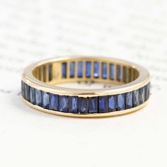 New from a limited production run, this eternity band showcases these long and leggy French cut sapphires beautifully, with stunning matched colors in 18kt yellow gold. 18kt yellow gold Size 6.5 & not resizable Sapphires are estimated to be VS type II clarities. GIA standards. Please see qualitative report for more information. Sapphire Eternity Band, Modern Mens Rings, Art Jewelry Earrings, French Baguette, French Cut, Bespoke Rings, Antique Watches, Antique Engagement, Vintage Band