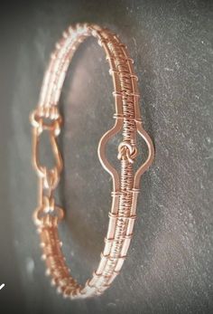 a close up of a bracelet on a wall